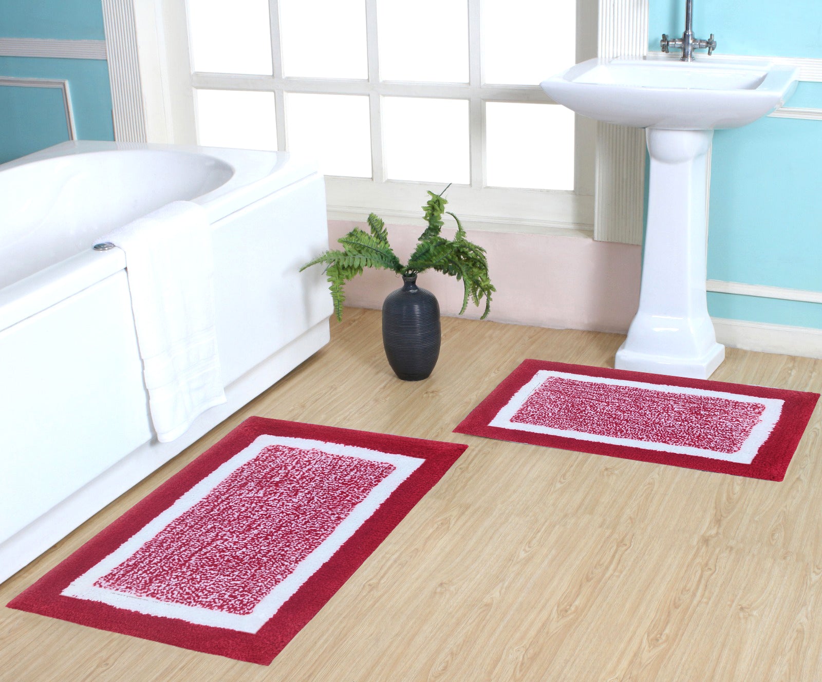 Set of two microfiber heavy bathmats from IR Home Furnishing, soft, plush bathroom carpets with textured surface.