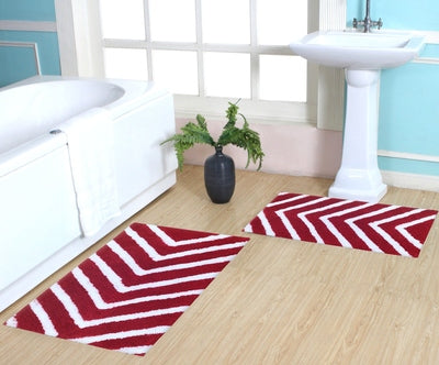 Set of two microfiber arrow-patterned bath rugs by IR Home Furnishing, soft and absorbent floor mats for bathroom decor.