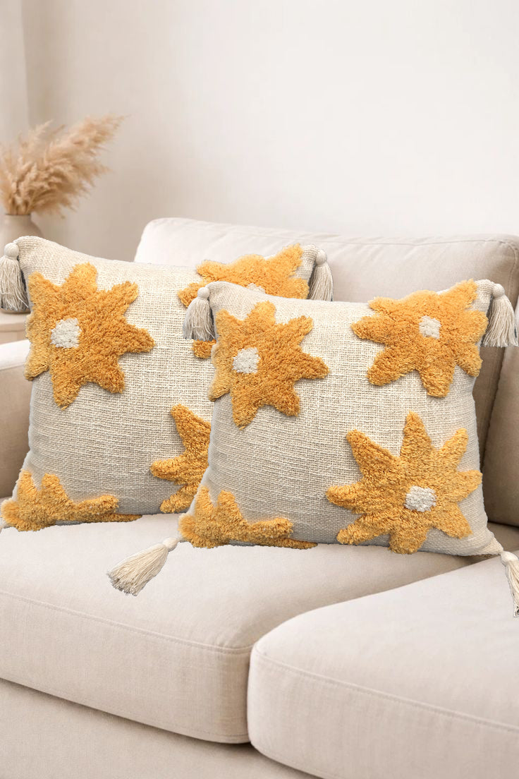 Set of two flower tufted cotton floor cushions from IR Home Furnishing, soft and decorative for living spaces.