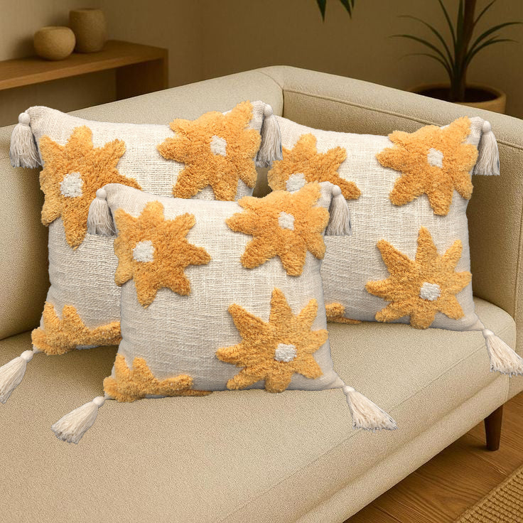 Set of three flower tufted cotton cushions by IR Home Furnishing, soft feather-filled cushions with floral patterns.