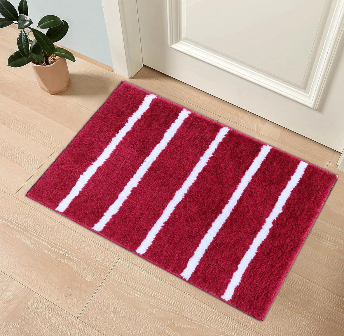 Microfiber stripe bathmat by IR Home Furnishing featuring modern design and soft, absorbent material for bathroom use.